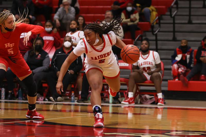Bolingbrook’s Kennedi Perkins makes a move at the top of the key against Homewood-Flossmoor in the Class 4A Bolingbrook Sectional championship. Thursday, Feb. 24, 2022, in Bolingbrook.