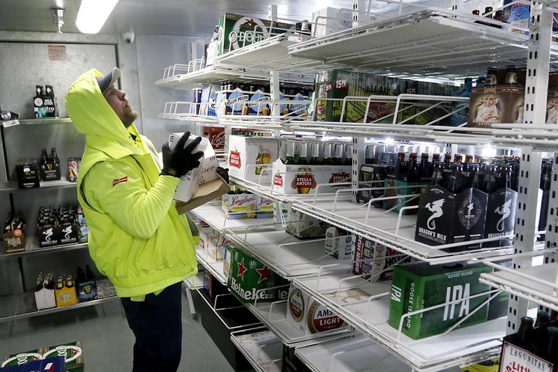 Patrick Hoff, of Lakeshore Beverage, stocks nonalcoholic beer into the cooler at McHenry Liquors, 1782 N. Richmond Road, in McHenry on Thursday, Jan. 5, 2023. The liquor store has a whole section dedicated to nonalcoholic beer.