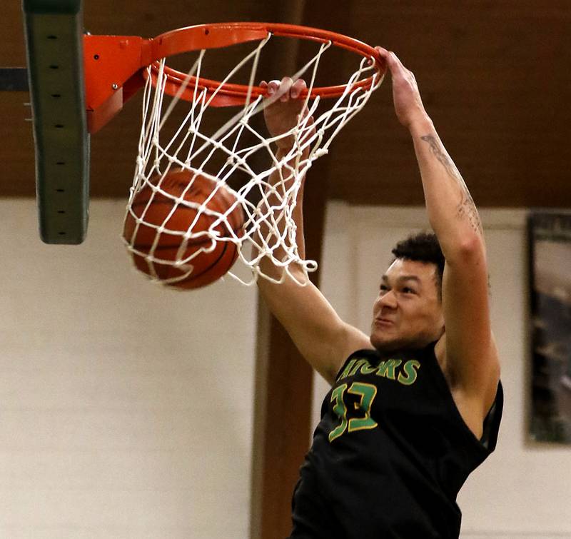 Crystal Lake South's Cooper Buelna dunks the basketball as wins the dunk contest during the boy’s game of McHenry County Area All-Star Basketball Extravaganza on Sunday, April 13, 2025, at Alden-Hebron’s Tigard Gymnasium in Hebron.