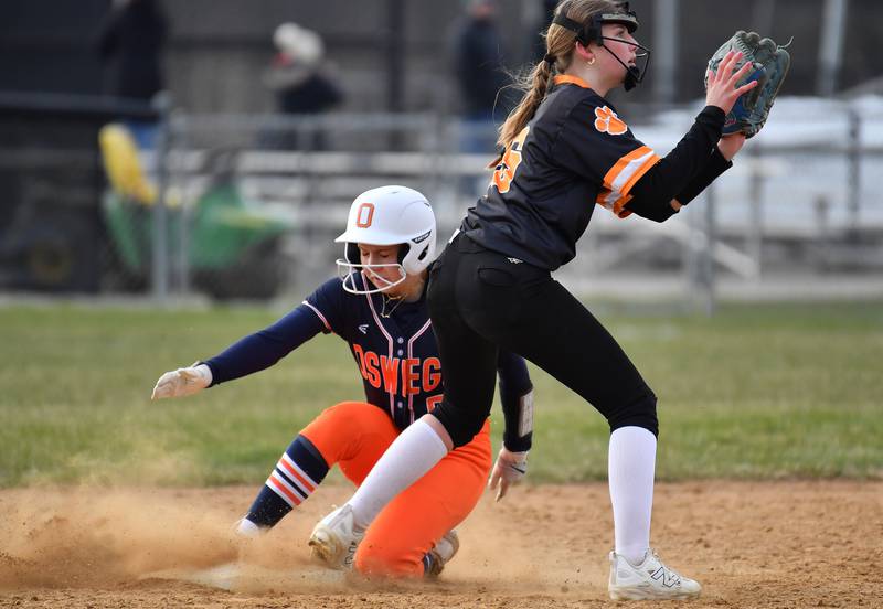 Oswego’s Adalynn Fugitt steals second base as Wheaton Warrenville South’s Rachel Chaney awaits the ball during a game on April 10, 2025 at Wheaton Warrenville South High School in Wheaton.