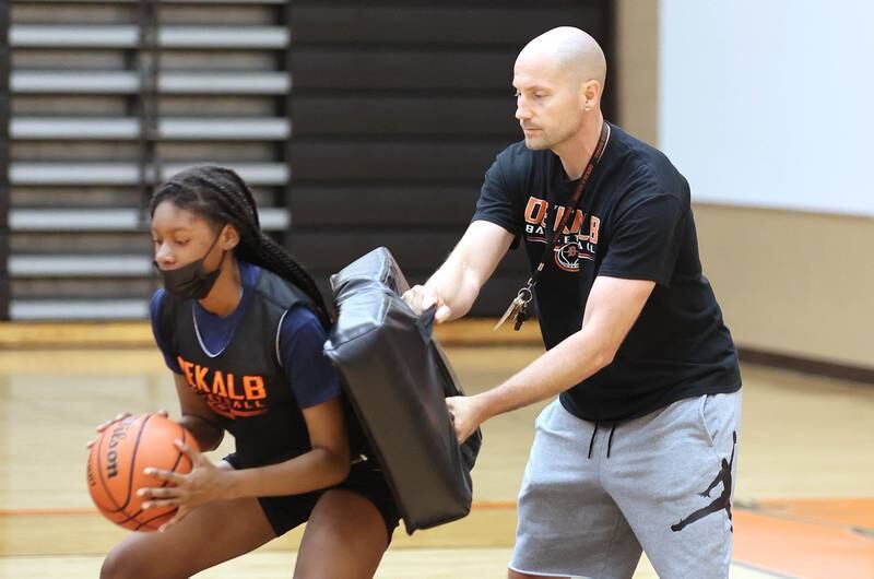 DeKalb's Brytasia Long works with new head coach Bradley Bjelk during a post up drill Thursday, June 23, 2022, at girls basketball practice at DeKalb High School.