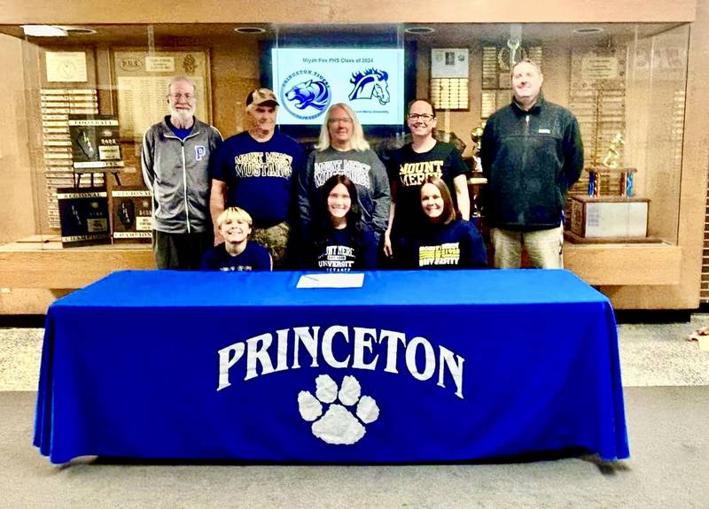Princeton senior Miyah Fox has signed to play volleyball and run track for Mt. Mercy College in Cedar Rapids, Iowa. She is a four-sport at PHS, having also played basketball and soccer. She was joined at her signing by her brother Izaiah Fox (front from left) and her mom Jaime Kunkel; and (back row) PHS track coach Pat Hodge, her grandparents Joe and Jill Kunkel, her aunt Jordan Kunkel and PHS volleyball coach Andy Puck.