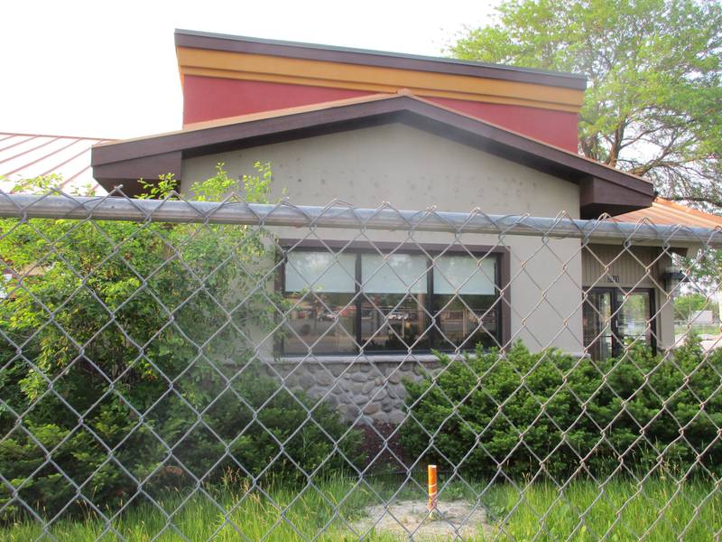 The former Bakers Square restaurant at 2211 W. Jefferson St. in Joliet is surrounded by a chain link fence on Monday, June 5. Emerald Coast has proposed converting the property to a cannabis dispensary.