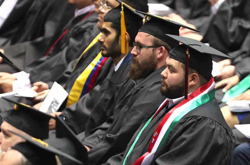 Graduation candidates listen to speakers in the Convocation Center Saturday, May 14, 2022, during the first of two undergraduate commencement ceremonies at Northern Illinois University in DeKalb.