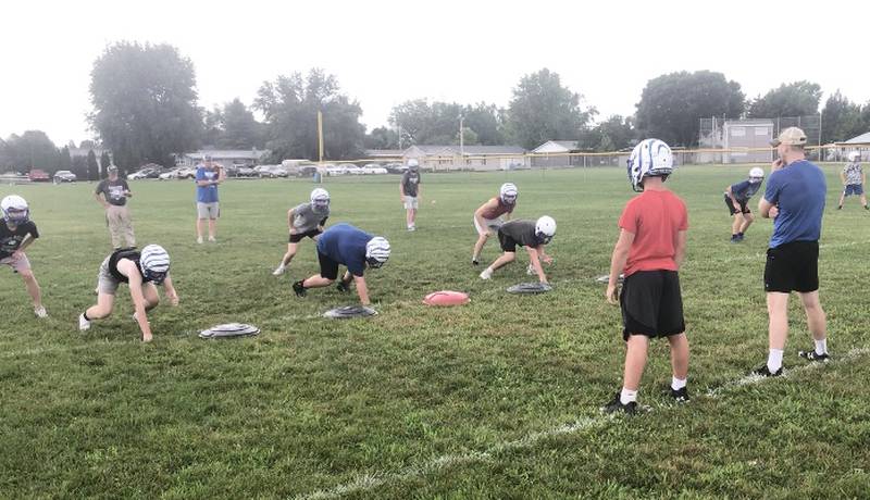 The Tigers line up for a drill during the first practice of the season Monday morning at Princeton.