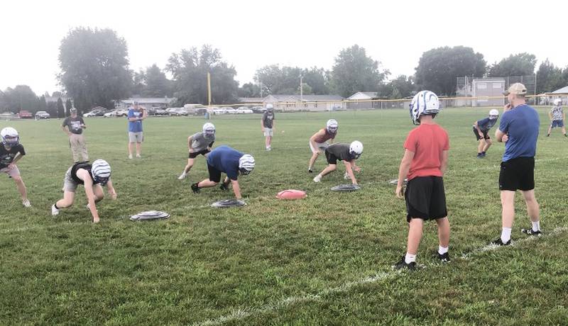 The Tigers line up for a drill during the first practice of the season Monday morning at Princeton.