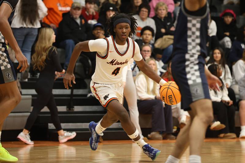Minooka’s Nehemiah Brown works the ball against Oswego East on Friday, Jan. 16, 2026 in Minooka.