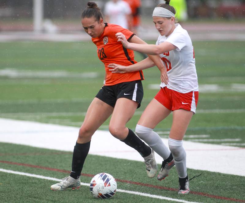 Crystal Lake Central’s Jillian Mueller (left) and Triad’s Kamryn Bohnenstiehl go after the ball during the Class 2A state championship game at North Central College in Naperville on Saturday, June 1, 2024.