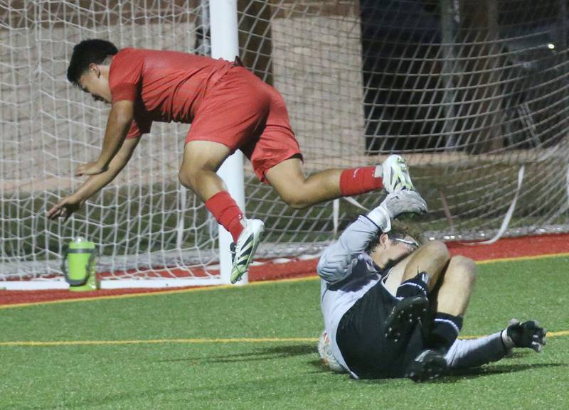 L-P's Ismael Mejia trips over Ottawa keeper Landry Brenbarger on Monday, Oct. 6, 2025 at the L-P Athletic Complex in La Salle.