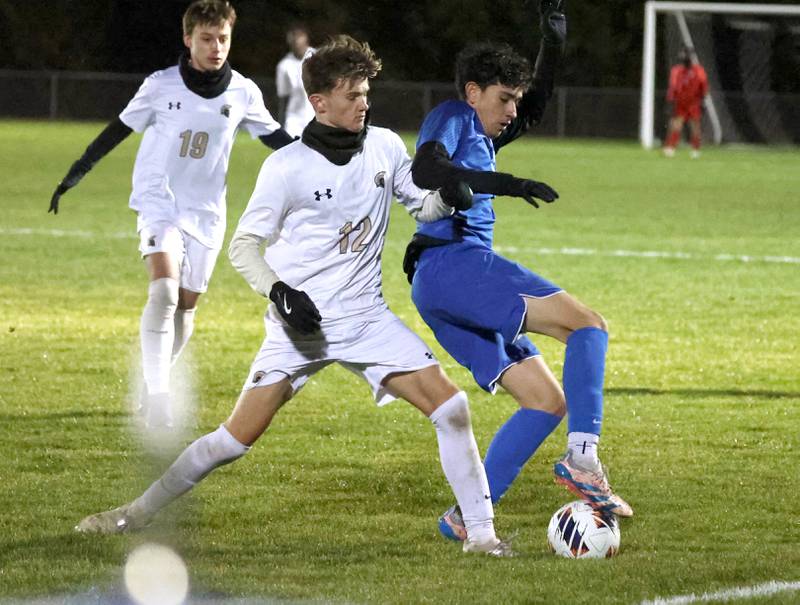 Sycamore's Andre Crouch and Burlington Central’s Aiden Jaimes battle for possession near the sideline Tuesday, Oct. 21, 2025, during their IHSA Class 2A regional semifinal match at Burlington Central High School.