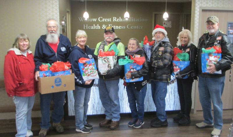 Pictured are ALR members Linda Oleson, Bob and Sandy Lawrence, Cliff Oleson, Sally and Bill Kolb, Cherie Mauer and Bob Mauer with their Christmas gifts for the veterans at Willow Crest Nursing Pavilion.
