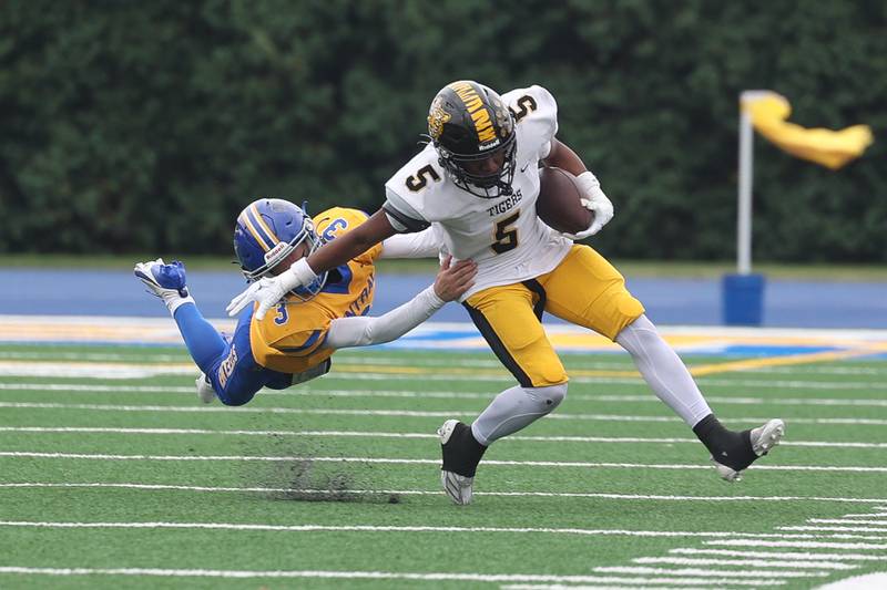 Joliet Central’s Jayden Poplawski brings down Joliet West’s Landon Mars on Saturday, Sept. 28, 2024 in Joliet.
