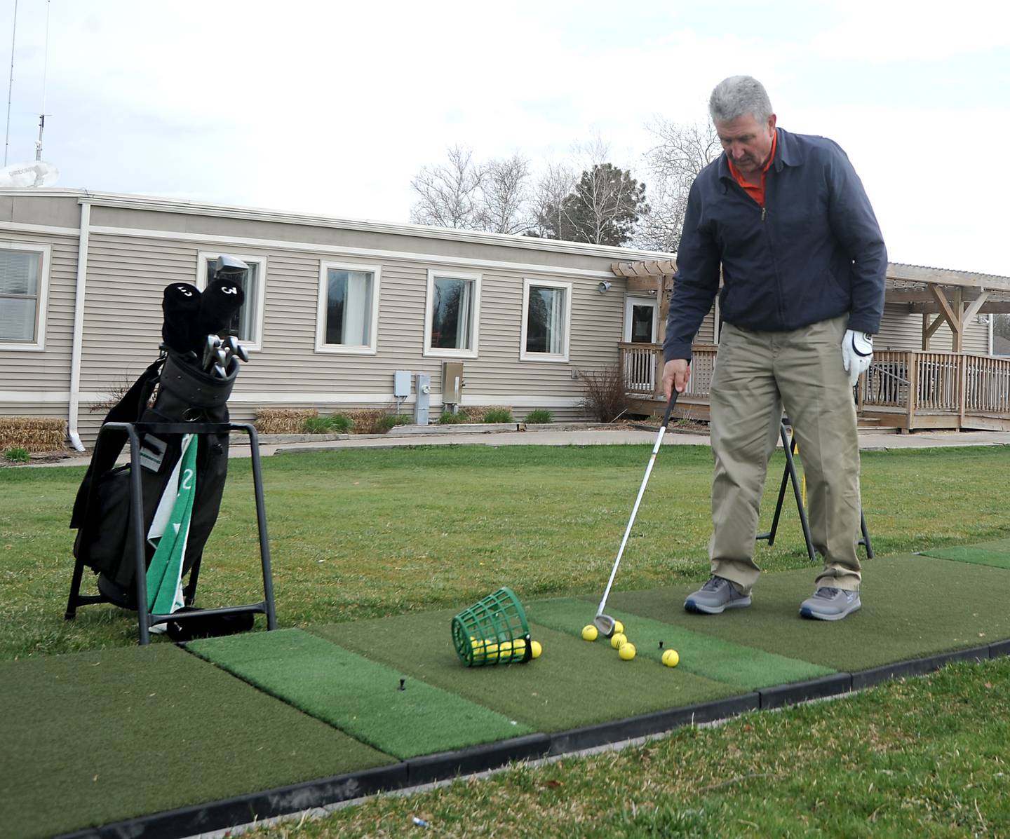 John Streit hits golf ball Wednesday, April 27, 2022, at the driving range at RedTail Golf Club, 7900 Redtail Drive in the Village of Lakewood. The golf club will be building a new clubhouse later this year