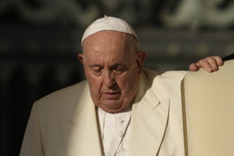FILE - Pope Francis arrives for his weekly general audience in St. Peter's Square, at the Vatican, Wednesday, Nov. 22, 2023. Pope Francis cancelled his trip to Dubai for the U.N. climate conference on doctors’ orders.  The announcement marked the second time the pope’s frail health had forced the cancellation of a foreign trip: He had to postpone a planned trip to Congo and South Sudan in 2022 because of knee inflammation, though he was able to make the trip earlier this year. (AP Photo/Andrew Medichini, File)