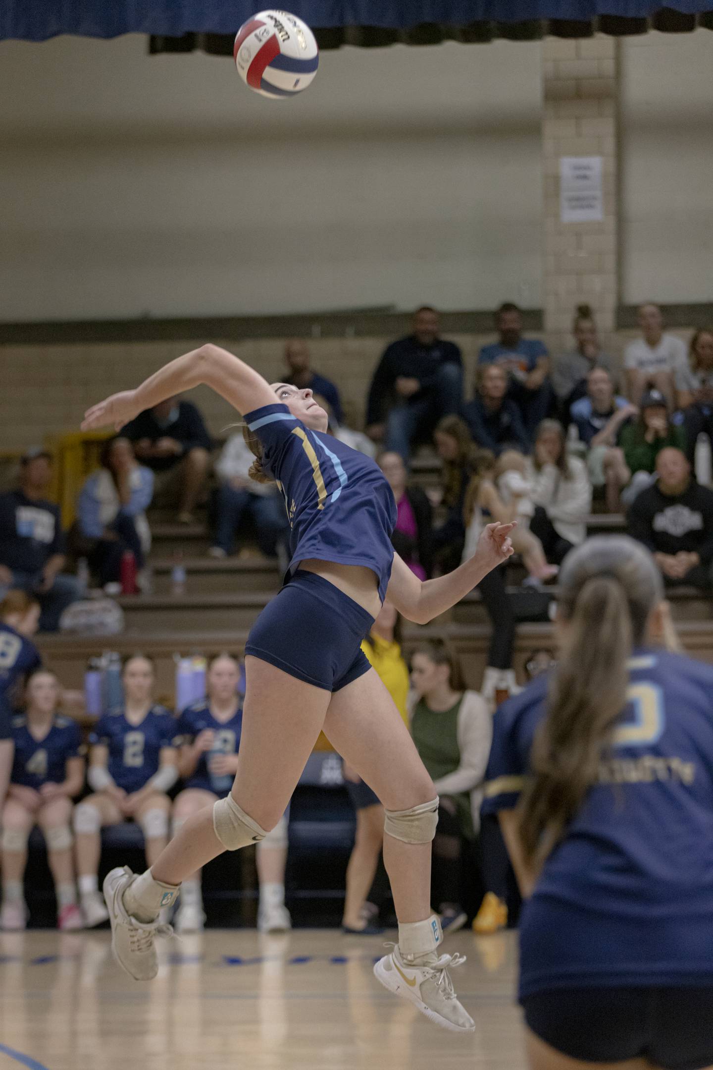 Marquette's Kinley Rick leaps to spike the ball over the net against Lexington High School during the Class 1A Sectional girls volleyball tournament at Bader Gym on November 5, 2024.