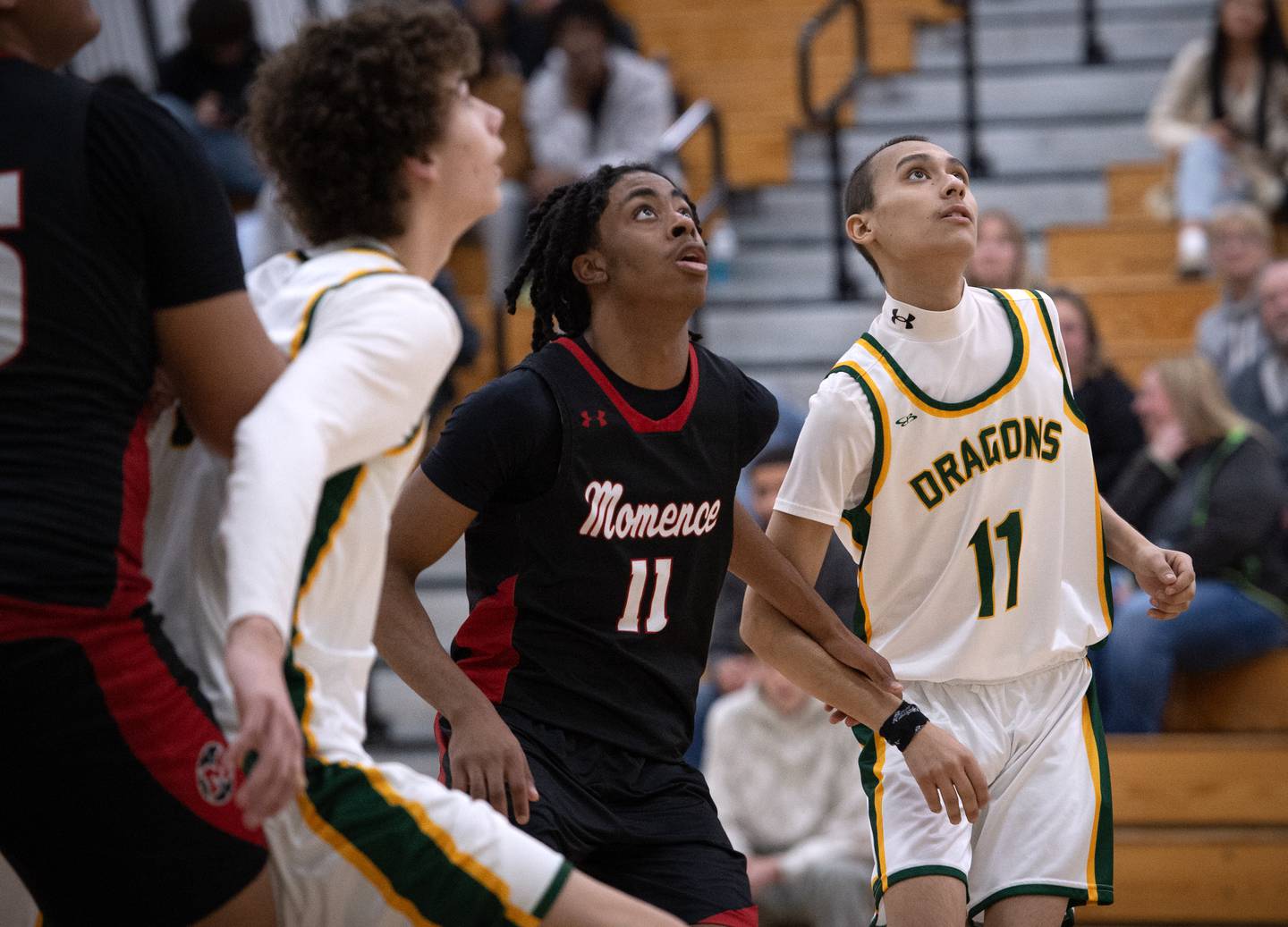 Grant Park's Luis Maldonado, right, looks for a rebound attempt in a game against Momence on Friday, January 16, 2026.