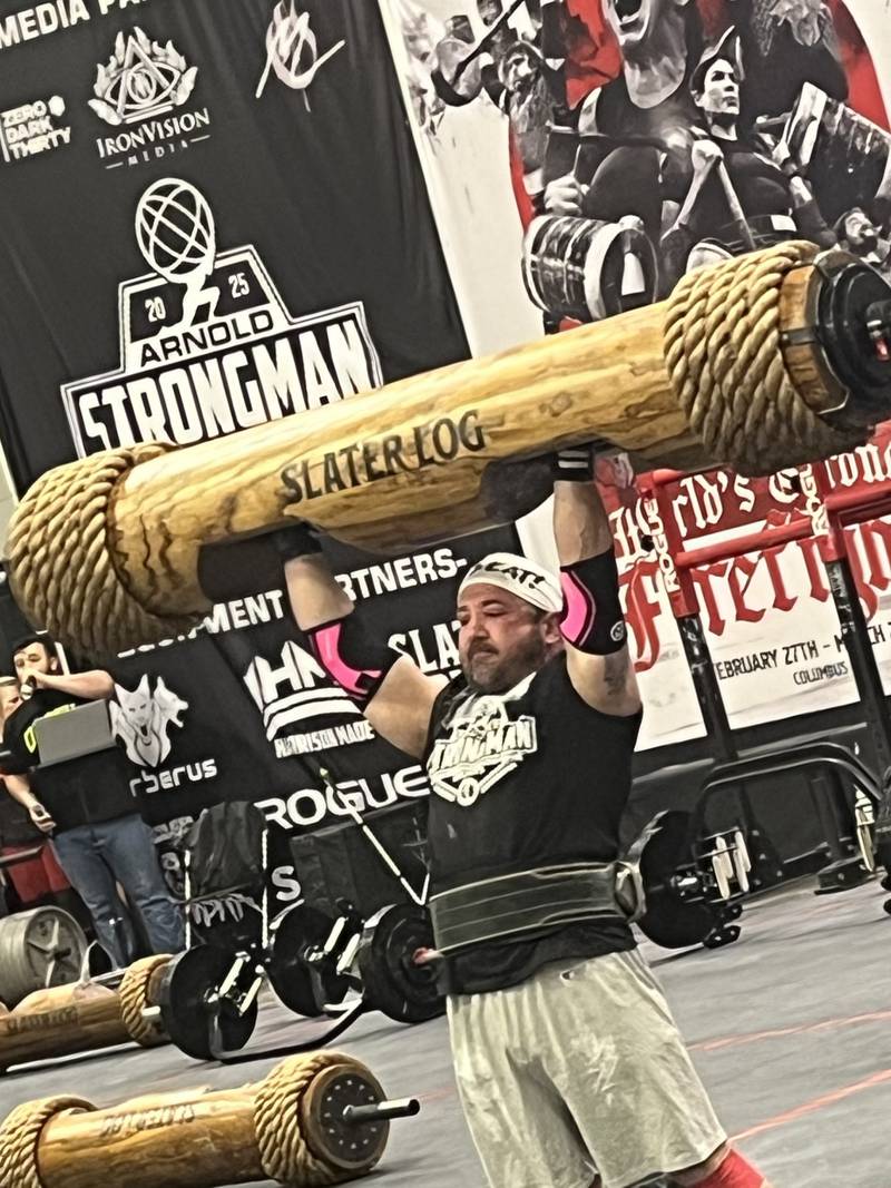 Crystal Lake native Quint Zambon hoists a Slater Log during the Arnold Master's Strongman Championship on March 2, 2025, in Columbus, Ohio. Zambon competed in the men's age 40-plus 198-pound weight class and won the title.