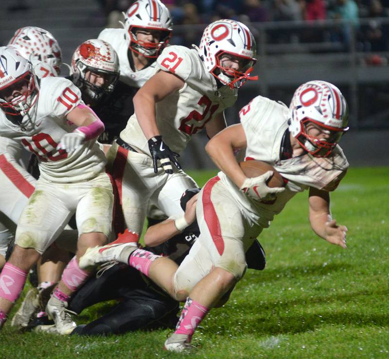 Oregon's Jakob Moser (32) almost breaks loose for a big gain against Stillman Valley on Friday, Oct. 10, 2025.