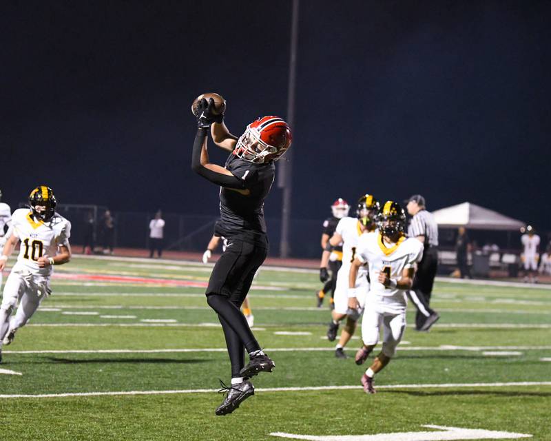 Yorkville's Colton Spychalski (1) catches the ball during the game on Friday Sept. 5, 2025, while taking on Joliet West held at Yorkville High School.