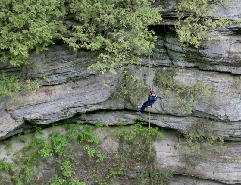 Ottawa firefighter Brazen Wheeler climbs down the side of a cliff during rope rescue training on Saturday, May 2, 2026 in Wildcat Canyon at Starved Rock State Park.