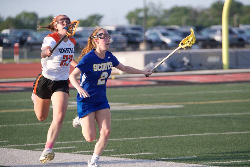 Lake Forest's Megan Rocklein advances the ball past Crystal Lake Central's Anna Starr  at the Super Sectional Final on Tuesday, May 30, 2023 in Huntley.