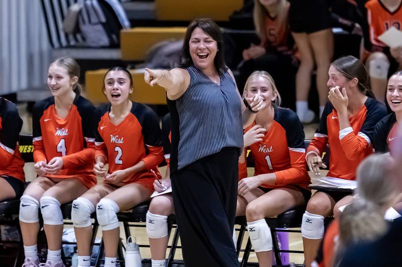 Lincoln-Way West varsity volleyball coach Kendall Villa cheers on the team during an away game against Joliet West on Sept. 15, 2025.