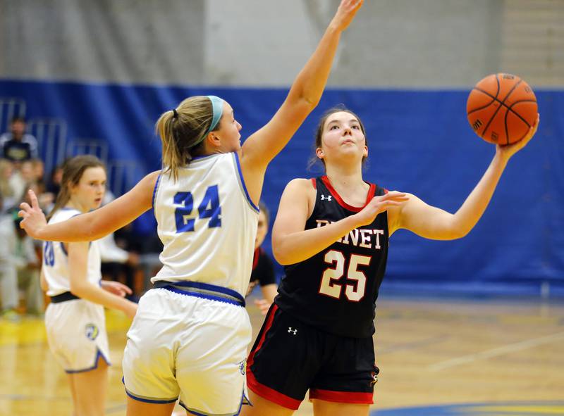 Lyons' Kennedy Wanless (24) tries to block the shot of Benet's Samantha Trimberger (25) during the girls varsity basketball game between Benet Academy and Lyons Township on Wednesday, Nov. 30, 2022 in LaGrange, IL.