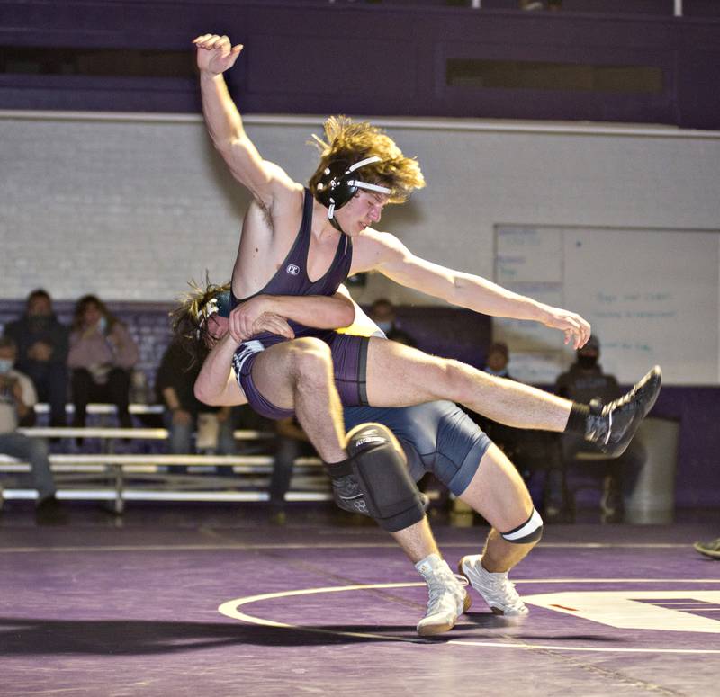Dixon's Owen Brooks is thrown by Sterling's Thomas Tate at 160lbs in Dixon on Wednesday, Jan. 12, 2022.