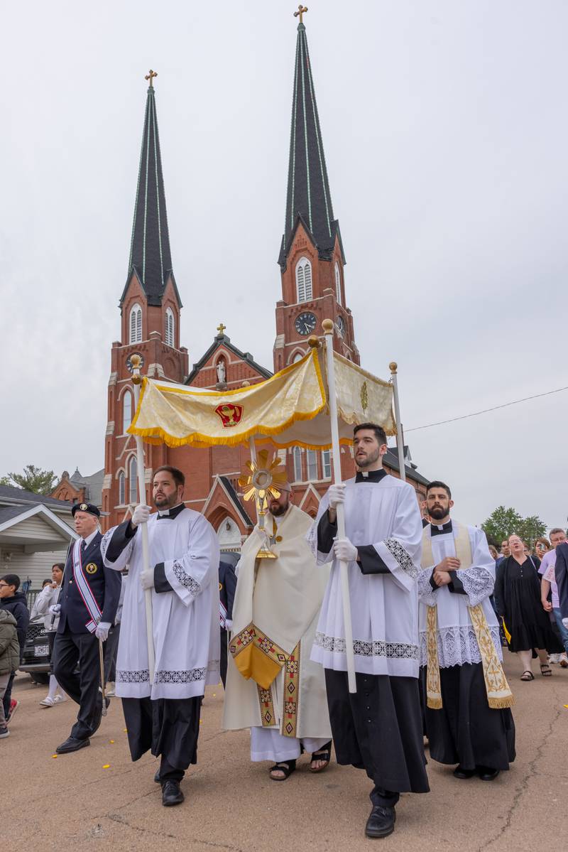 The Eucharist makes its way across La Salle in a procession from St. Hyacinth Church to the Queen of the Holy Rosary Shrine on May 19, 2025. The walk was part of the National Eucharistic Pilgrimage that began in the Archdiocese of Indianapolis. It also made stops at Seneca's St. Patrick Church and St. Mary's Church in Utica.