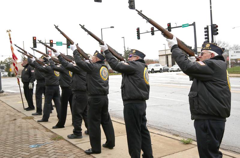 Members of the DeKalb American Legion Post 66 Honor Guard fire a 21 gun salute Thursday, Nov. 11, 2021, during a Veterans Day and Soldiers' and Sailors' Memorial Clock rededication ceremony at Memorial Park in downtown DeKalb.