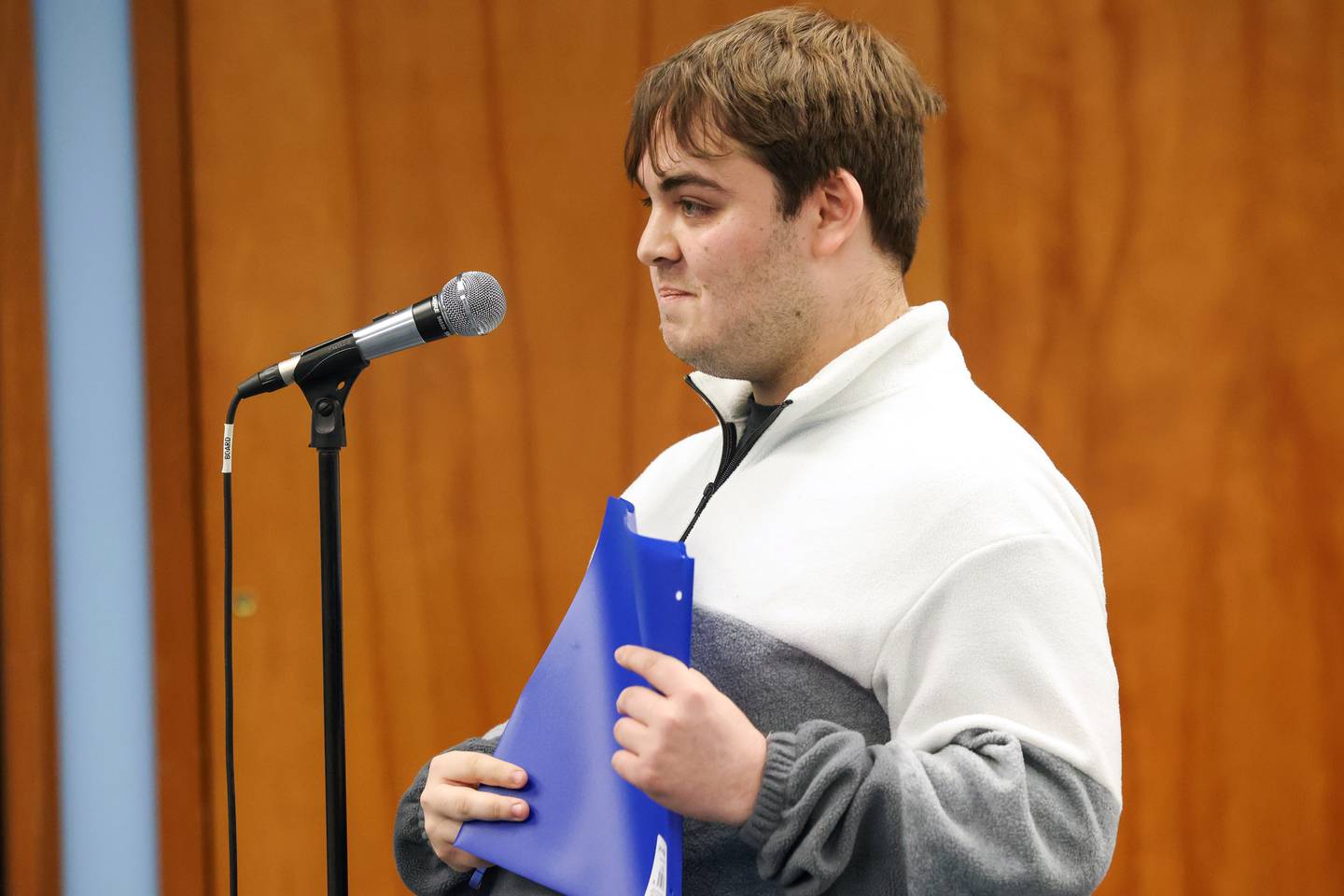 Bourbonnais resident Dominic Compton speaks to trustees and village officials during the board meeting’s public comment session on Monday, Feb. 2, 2026, to consider passing an ordinance that would clarify that village-owned property should not be used for civil immigration enforcement activities.