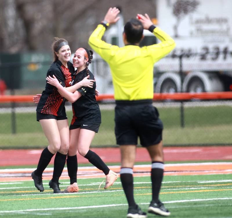 St. Charles East’s Abby Sempstrott (left) celebrates her goal with teammate Brooklyn Grossi during a game on Tuesday, April 1, 2025 against Burlington Central in St. Charles.