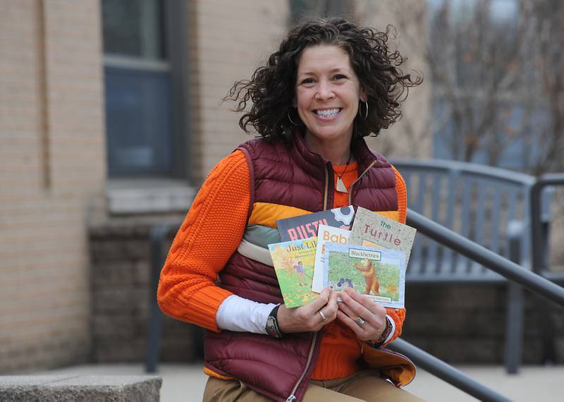 Mal Keenan, who has served as the Reading Recovery teacher for Crystal Lake Elementary School District 47, outside one of the schools she travels between to help students. Reading Recovery is a research-based, short-term intervention delivered one-on-one for first-grade students.