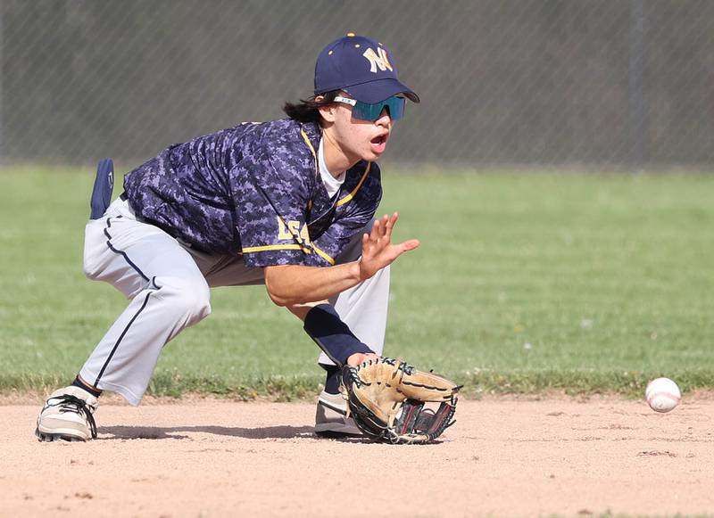 Neuqua Valley's Brendan Morris fields a ball at second base during their game against DeKalb Tuesday, May 7, 2024, at DeKalb High School.