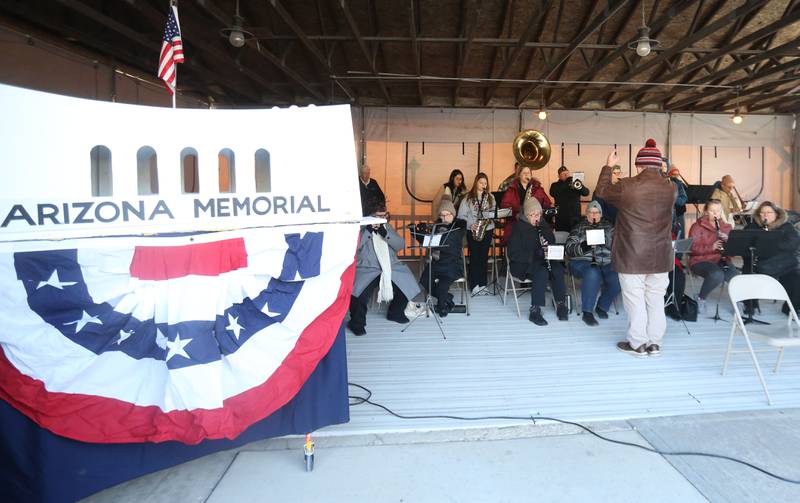 A U.S. Arizona Memorial display and the Peru Municipal Band perform the "Star Spangled" Banner" during the annual Pearl Harbor parade and memorial service on Saturday in Peru. This year marks the 83rd anniversary of the Dec. 7, 1941, attack on Pearl Harbor.