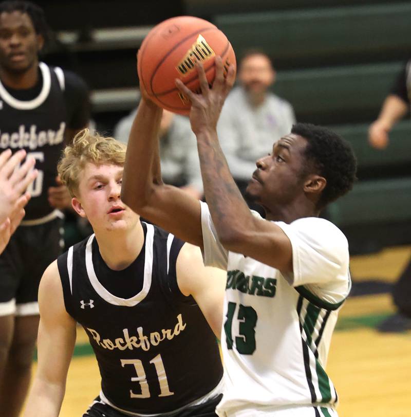 Kishwaukee College's Carron Gibson goes by Rockford University's Landon Nawracaj Thursday, Jan. 22, 2026, during their game at Kishwaukee College in Malta.
