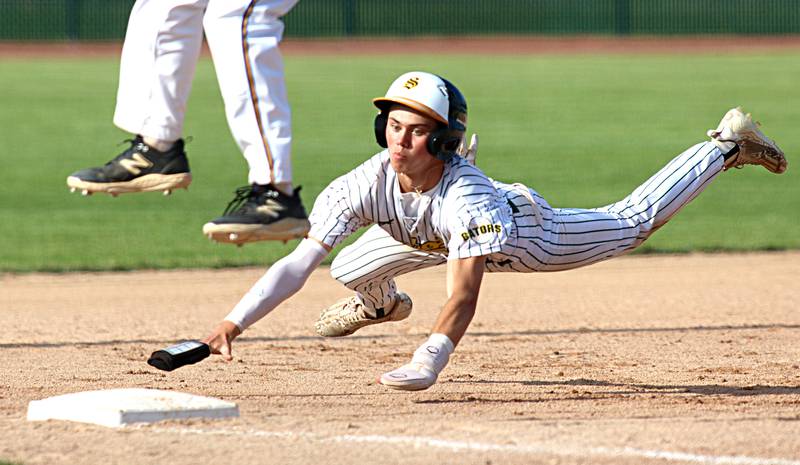 Crystal Lake South’s Xander Shevchenko lands safely at third base before scoring on an error against Lake Forest in Class 3A baseball regional action at Crystal Lake Thursday.