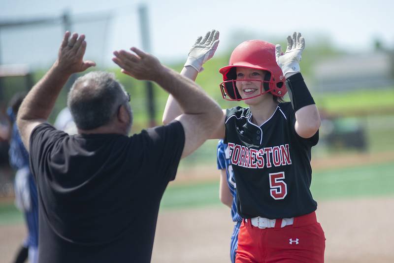 Forreston’s Hailey Greenfield celebrates an RBI against Newark Saturday, June 4, 2022 during the IHSA Class 1A softball state third place game.