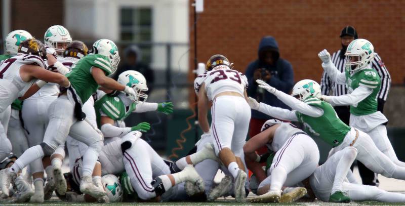 Loyola's Johnny McGuire (33) dives in for a touchdown during the IHSA Class 8A semifinal football game Saturday November 19, 2022 in Elmhurst.