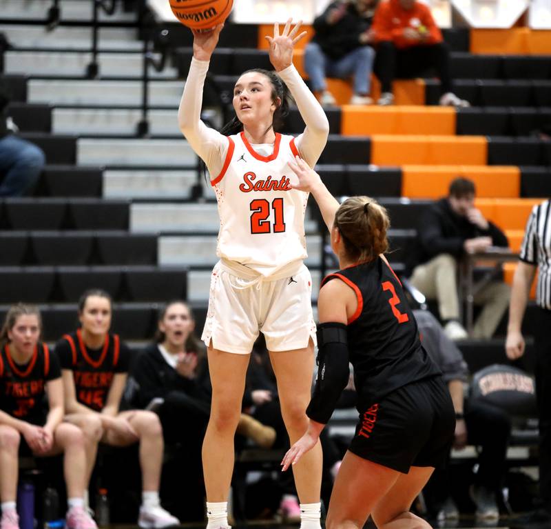St. Charles East's Sofia O’Sullivan shoots three points during a game against Wheaton Warrenville South on Tuesday, Feb. 11, 2025 in St. Charles.