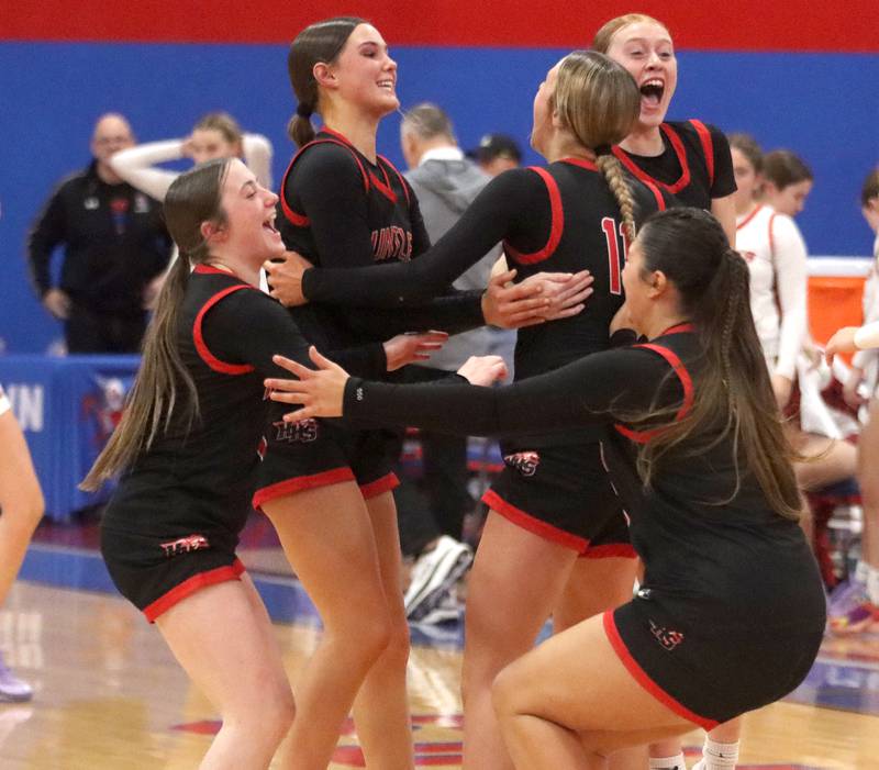 Huntley’s Red Raiders celebrate a win over Maine South in Komaromy Holiday Classic varsity girls basketball championship game action on Monday, Dec. 30, 2024, at Dundee-Crown High School in Carpentersville.