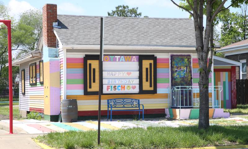 The "rainbow house" located at 1517 La Salle Street is painted different shades of colors on Tuesday, May 9, 2023 in Ottawa. The home was purchased by Mike Carretto of Carretto and Associates in 2017. He planned to demolish the house and put in a gravel parking lot, but was discouraged after his contractor was told by the city he would be required to dig up La Salle Street to disconnect the water line at the water main in the middle of the street and terminate the sewer line at the property line.He figured the city would eventually concede in order to have the vacant building demolished, but when they didn’t he started to paint the house in an effort to get their attention as well as that of neighbors.
