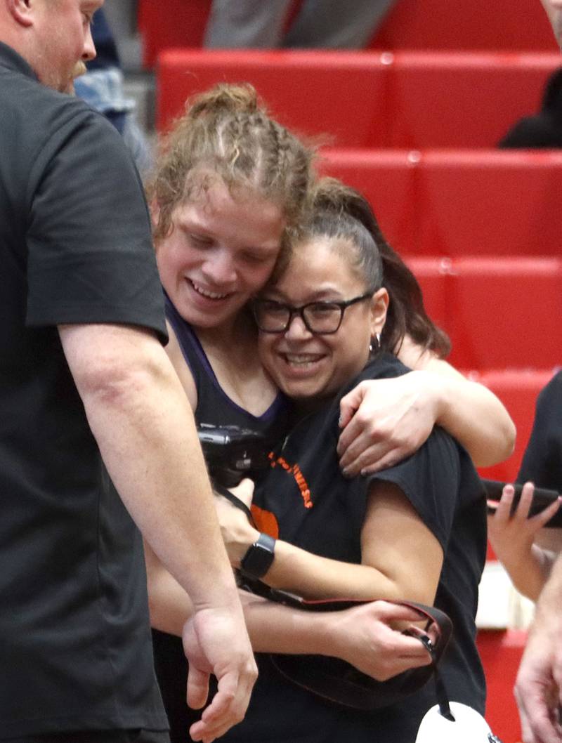 Hampshire’s Samantha Diehl is greeted after defeating  Schaumburg’s Nadia Razzak at 190 pounds in the title bout of varsity girls IHSA Sectional wrestling on Saturday, February 14, 2026, at Schaumburg High School in Schaumburg.