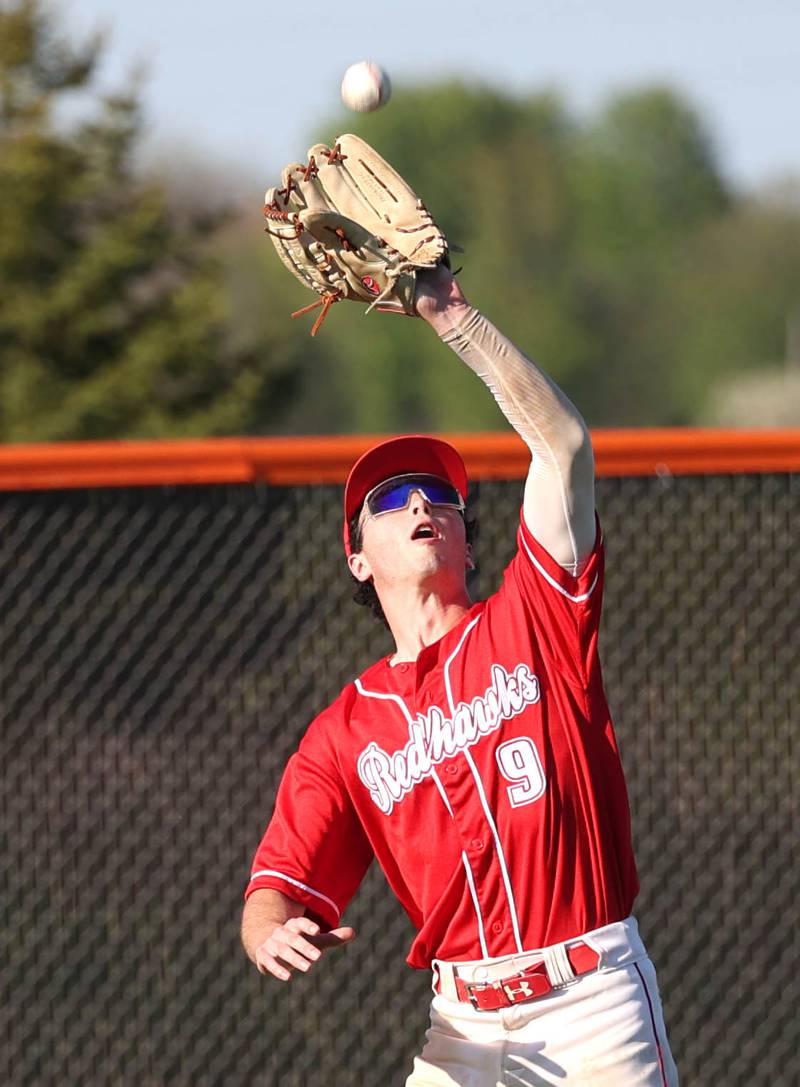 Naperville Central's Bruno King catches a flyable in the outfield during their game against DeKalb Tuesday, April 30, 2024, at DeKalb High School.