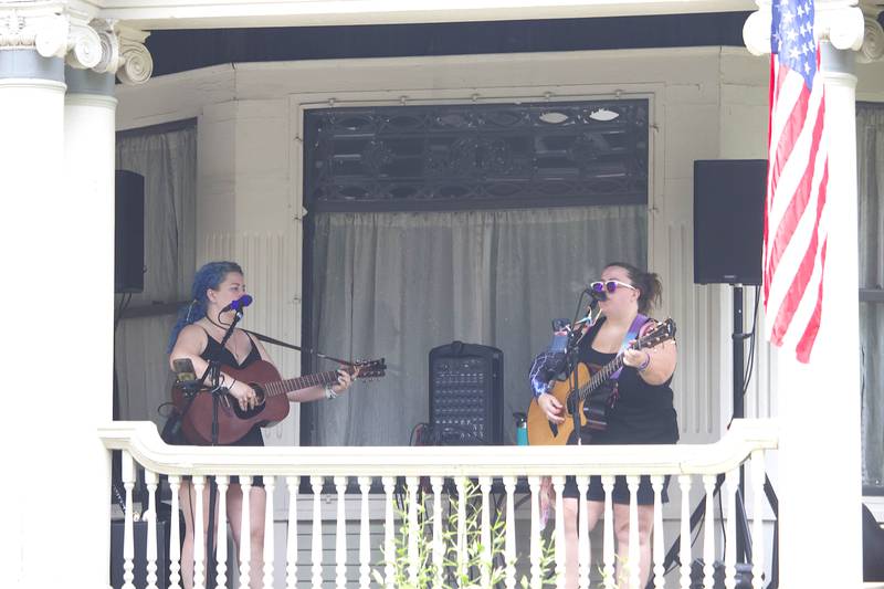 Musicians Colleen Wilde (left) and Cheryl Rodey perform in the 600 block of Campbell Street in Joliet as part of the Porch and Park Music Fest on Saturday, Aug. 16, 2025.