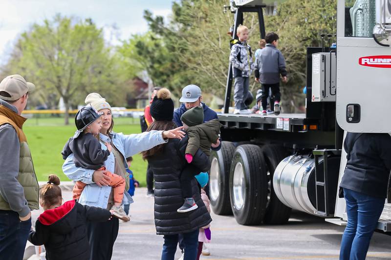 Parents with their children attend the La Grange Touch a Truck event. April 22, 2023.