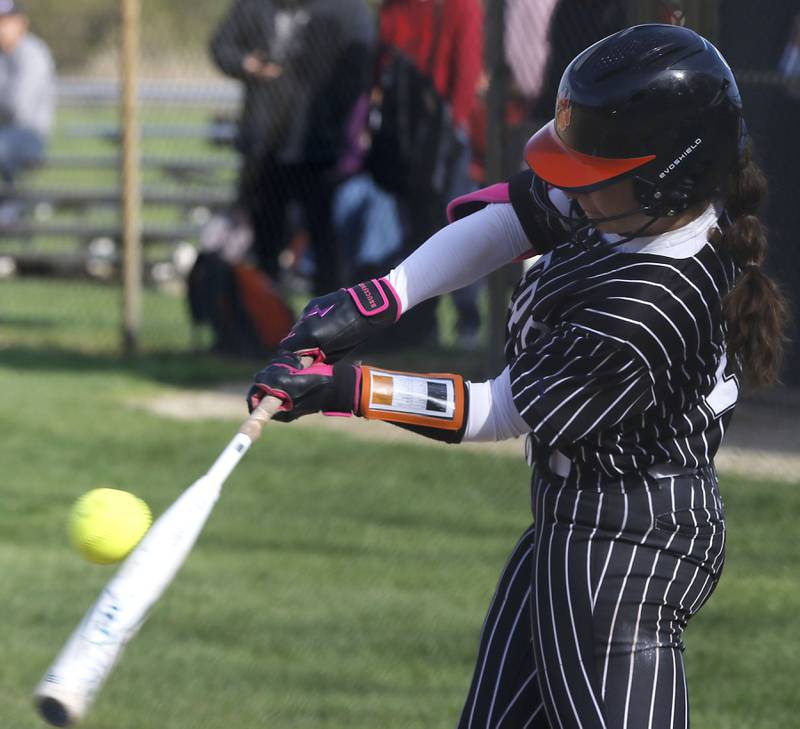 Crystal Lake Central's Elise Thorsen connects with the bal during a Fox Valley Conference softball game against Prairie Ridge on Monday, April 20, 2026, at Prairie Ridge High School.