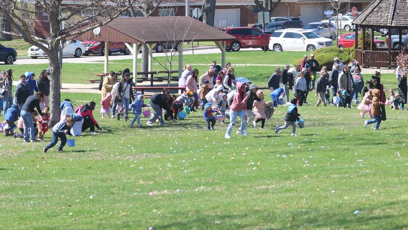Kids race to find eggs during the Easter Egg Hunt on Saturday, March 28, 2026 at Centennial Park in Peru.