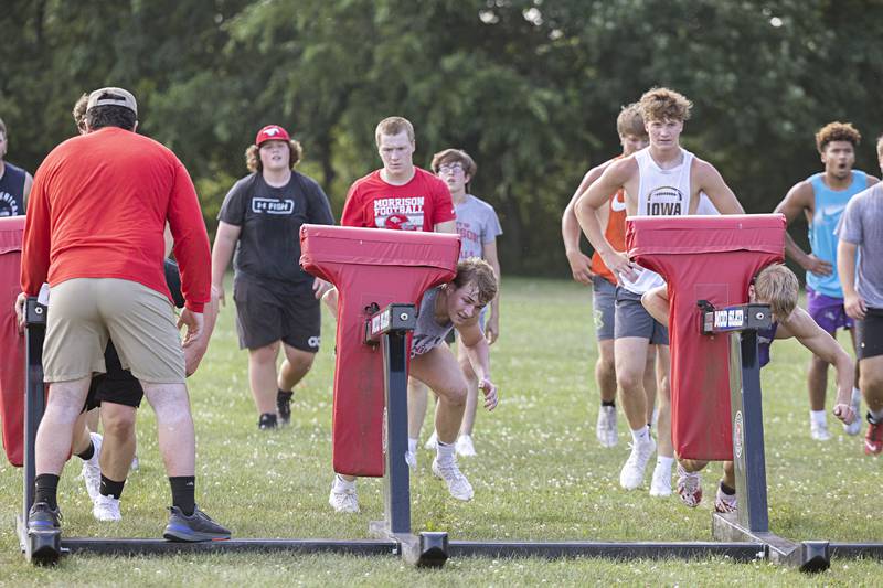 The Morrison football team goes through workouts during a camp Tuesday, July 25, 2023. The Mustangs will open their season against Mendota at the end of August.