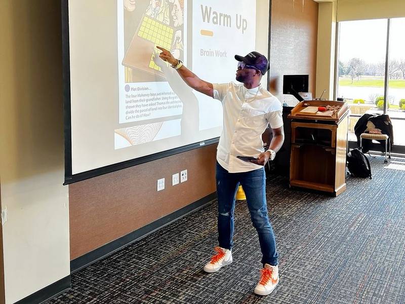 Willie Tunstall, founder of Tailoring Youth to Succeed, leads a communication and problem-solving workshop. Tunstall started TYS to mentor kids in workplace readiness.